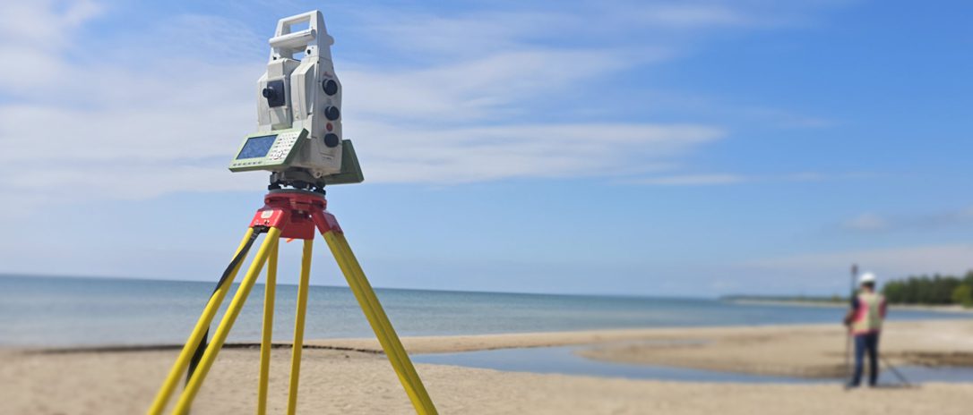 Infield Surveying Inc. land surveyor working on a land surveying project at Wasaga beach, Ontario